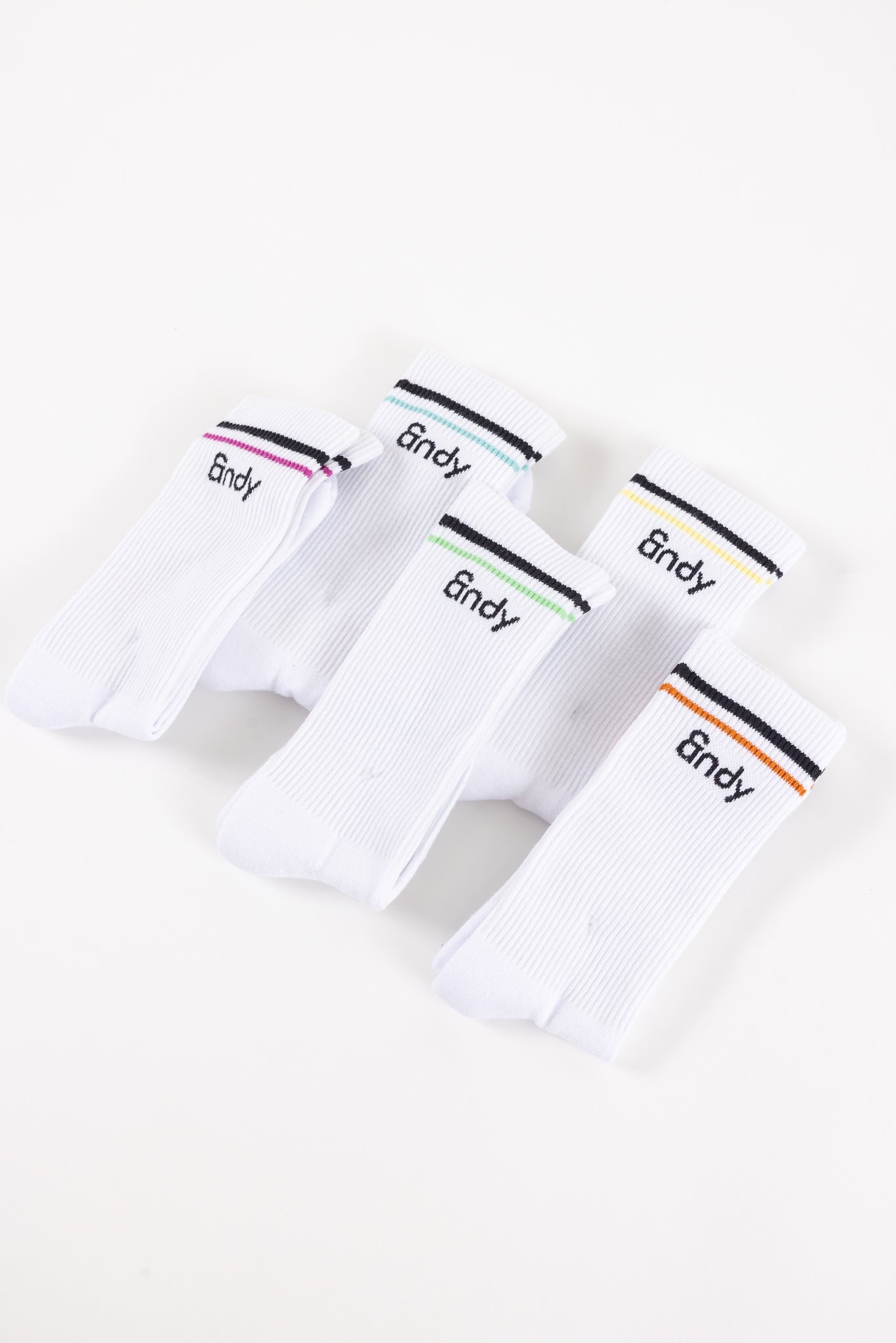 Four white boxer briefs with '&ndy' branding on a white background