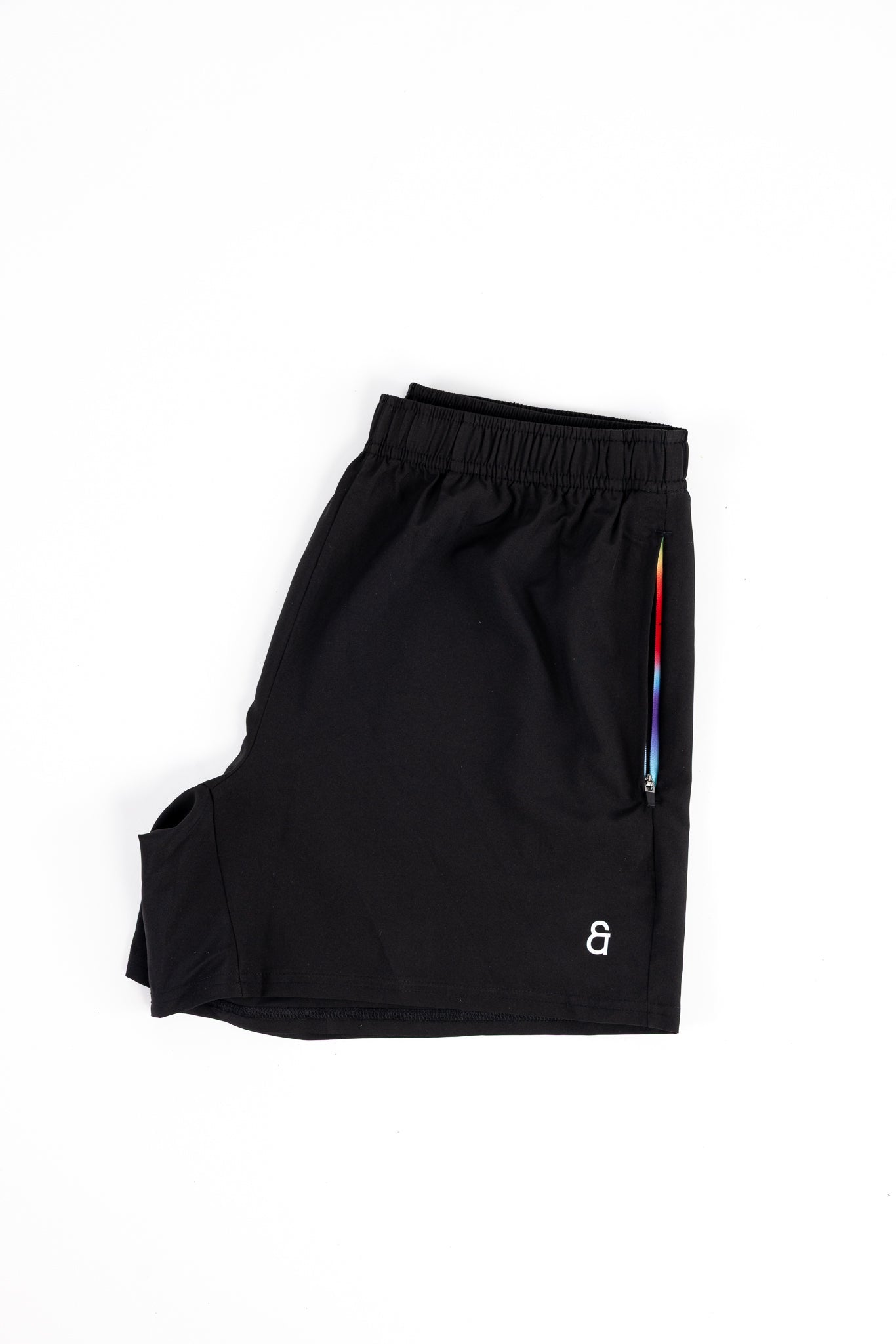 Close up of rainbow gradient pocket detail on black Andy Prism Shorts