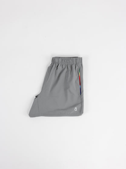 Close up of rainbow gradient pocket detail on Andy Prism Shorts.