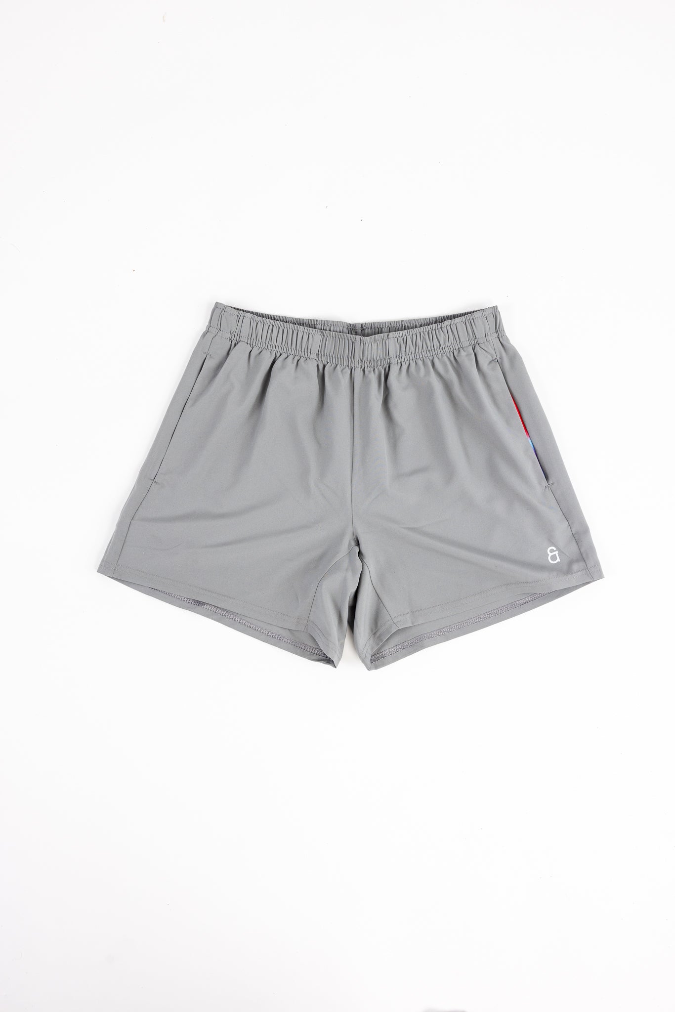 Gray shorts with a brand logo on a white background