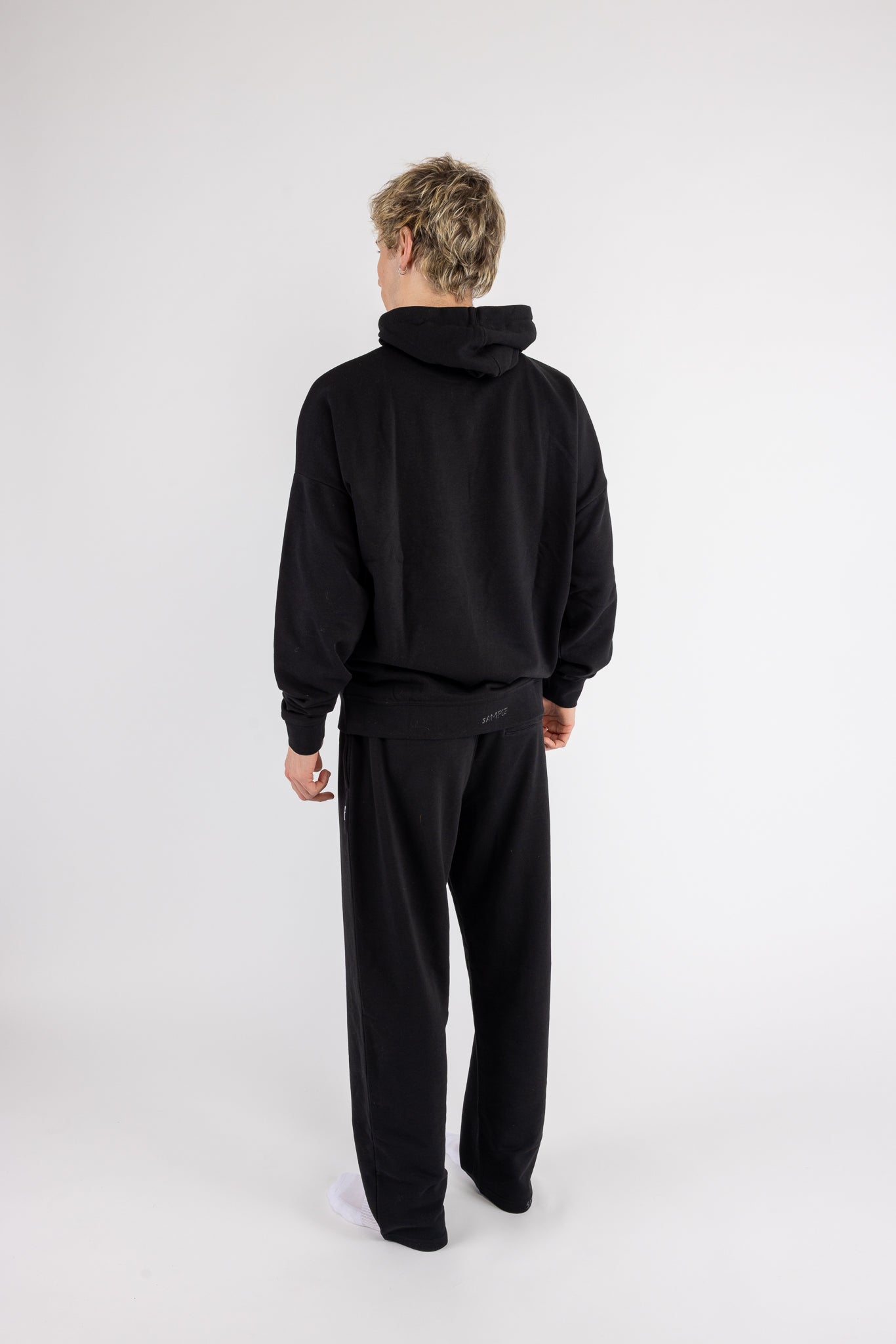 Man wearing the Arco Hoodie Set by ANDY