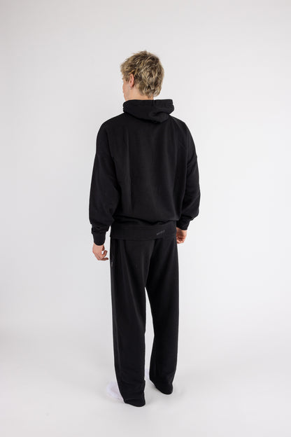 Man wearing the Arco Hoodie Set by ANDY