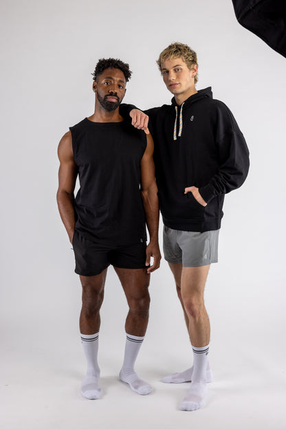 Two men wearing Andy gay activewear on white background