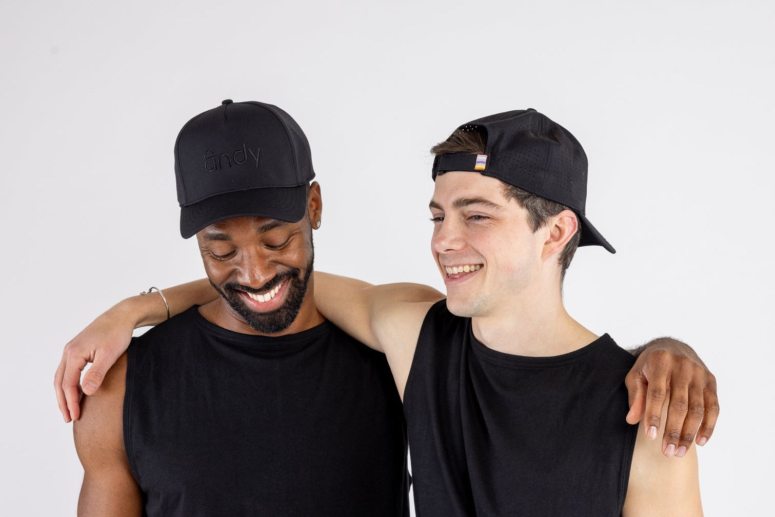 Two men wearing the Gym Trucker Hat by ANDY