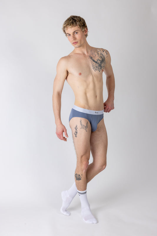 Man wearing a blue underwear set on a white background