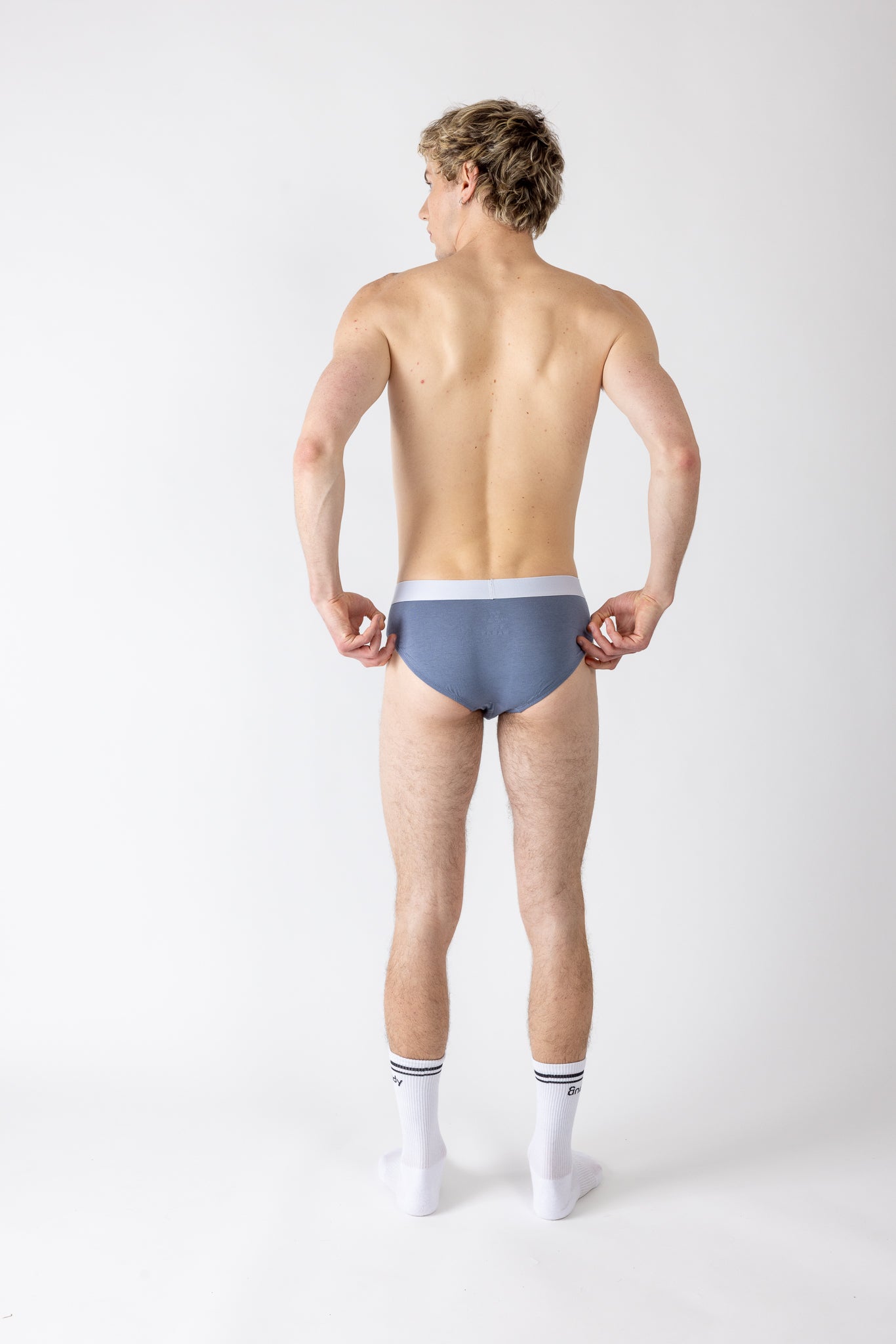 Man wearing a light blue underwear on a white background