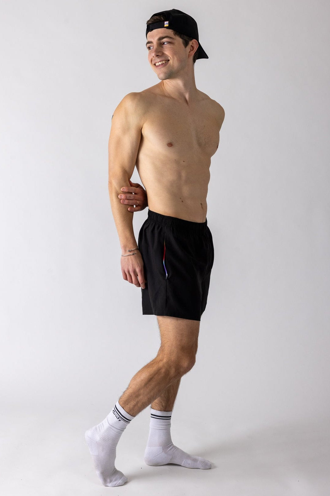 Man wearing Andy Prism Linerless Shorts 4" in Gray on white background