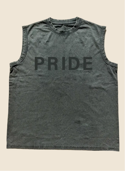 Black sleeveless shirt with 'PRIDE' printed on it, placed on a wooden surface.