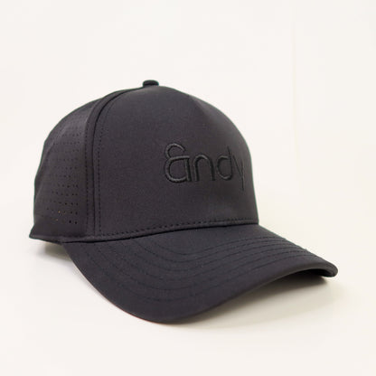 Black cap with a brand logo on a light gray background
